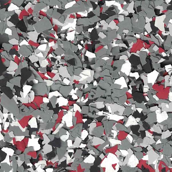 The image depicts a close-up view of a multi-colored, speckled pattern featuring red, gray, white, and black fragments, resembling terrazzo or epoxy flooring.