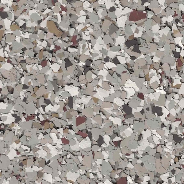 The image shows a textured surface composed of irregular, multicolored speckled fragments in shades of gray, beige, white, and brown. No landmarks are visible.