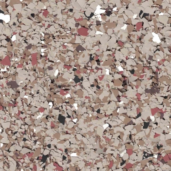 The image shows a close-up of a tan, red, and black speckled surface with a textured, fragmented pattern, resembling a terrazzo or epoxy floor.