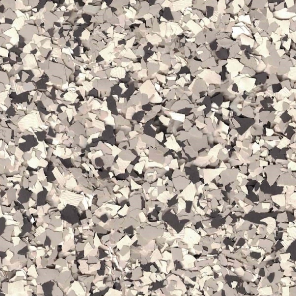 The image depicts a close-up view of a gray and white textured surface resembling stone, gravel, or terrazzo flooring, with scattered irregular-shaped pieces.