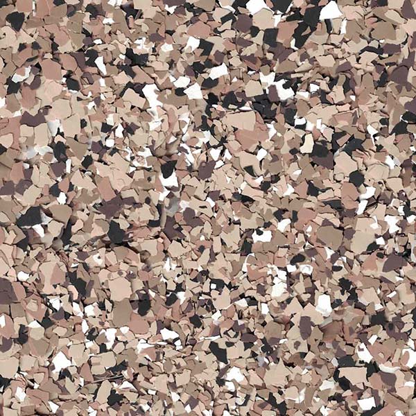 This image shows a close-up view of multicolored, irregularly shaped flakes, resembling a camouflage pattern with hues of brown, black, and white.